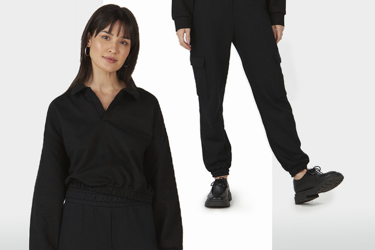 Mulher utilizando blusão preto em moletom e calça jogger com bota para trabalhar. 