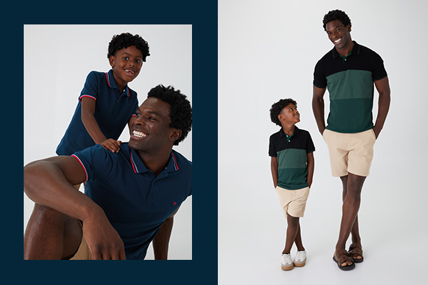 Dia dos Pais com roupas combinando: Pai e filho, ambos negros com cabelos curtos e crespos, posam vestindo camisas polos iguais. Eles sorriem para a câmera diante de um fundo cinza.