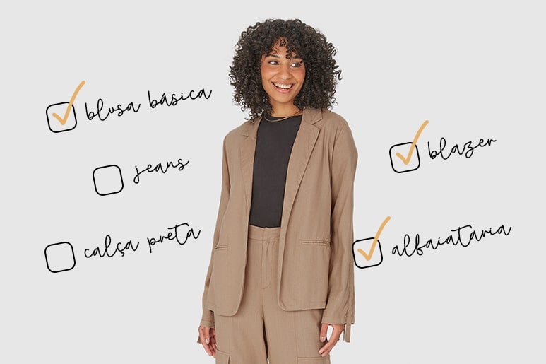Mulher vestindo um conjunto de blazer e calça de alfaiataria bege o centro da foto.